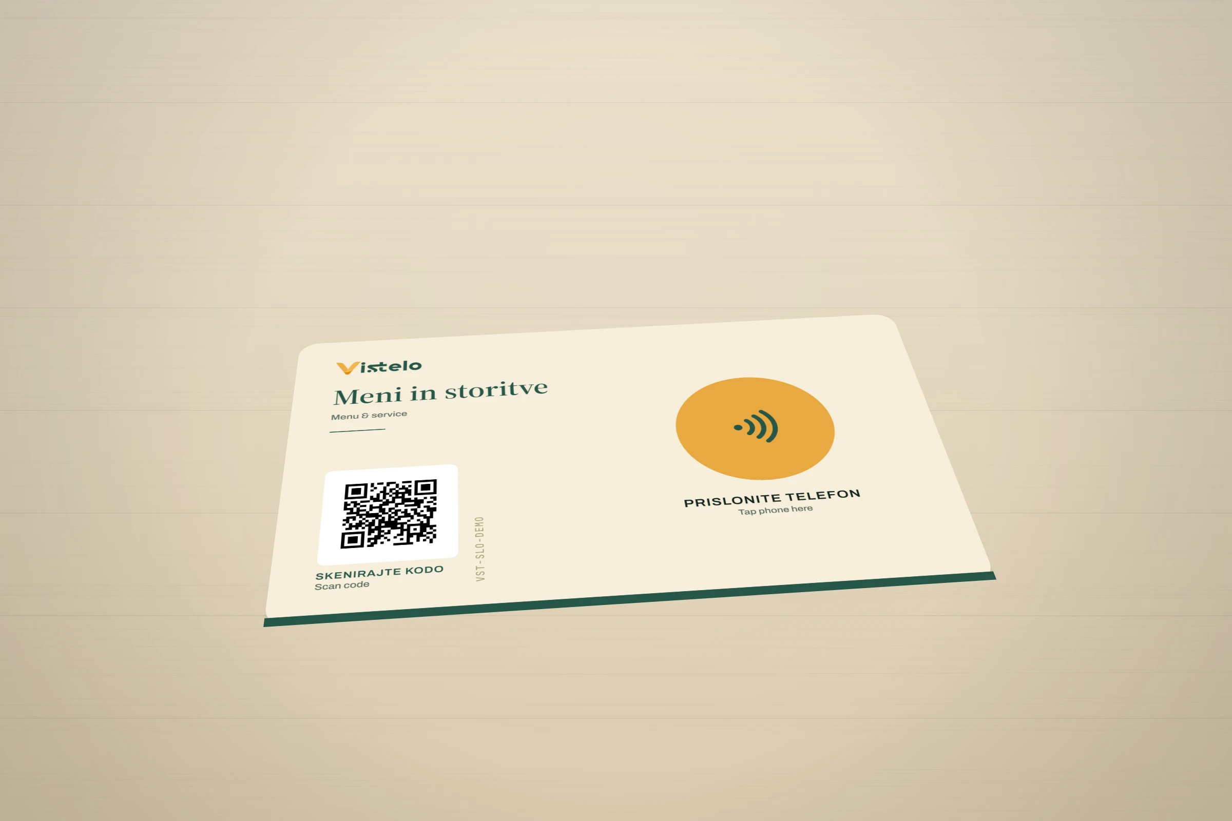 The horizontal Vistelo card lying on a café table beside an espresso